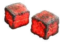 Burning coconut charcoal briquette from Cocobriq glowing red with heat